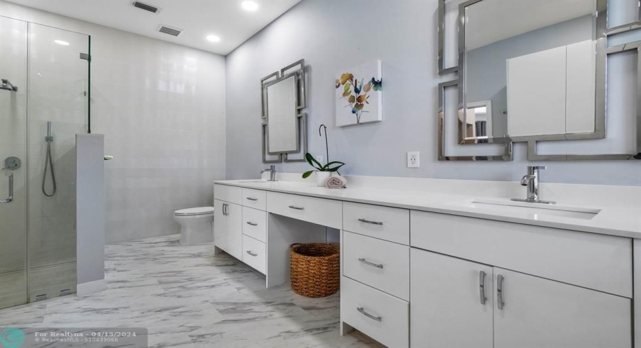 Gorgeous primary bathroom fit for royalty with added storage area!