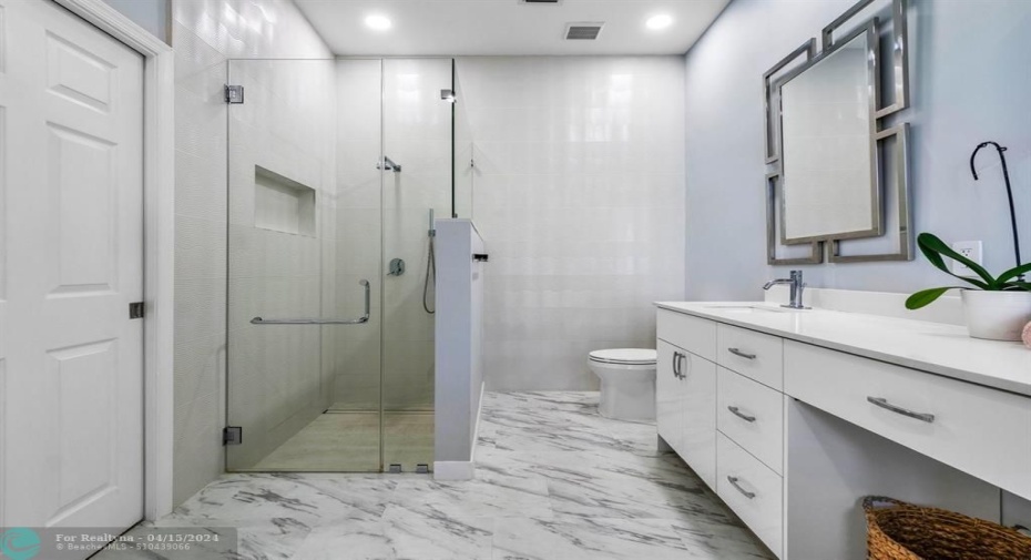 Framelss shower in primary bathroom with designer touches throughout!