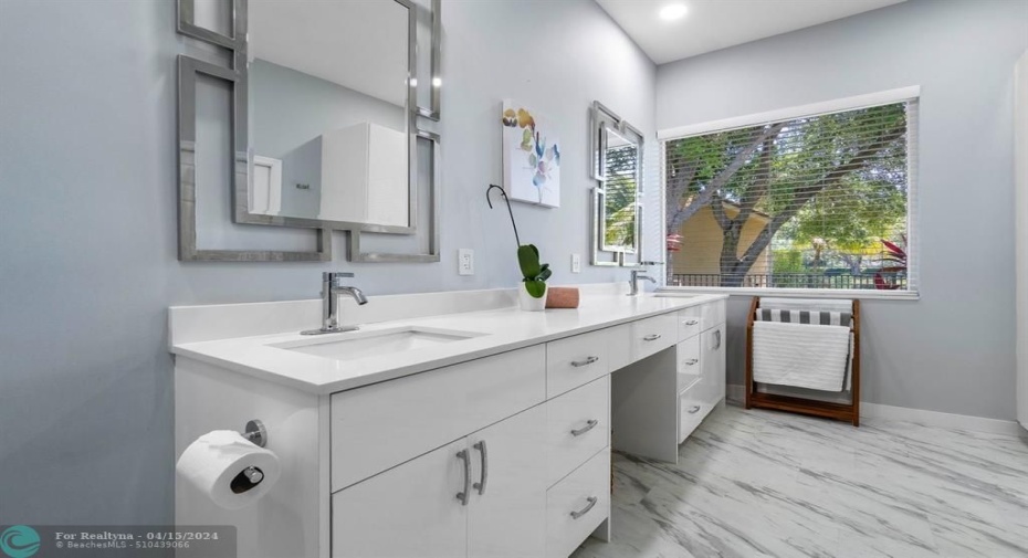 Double sinks and added storage create a useful and beautiful primary bathroom!
