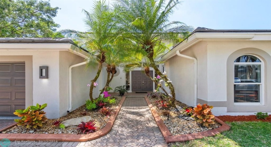 Double Door entry welcomes you home! Lushly landscaped, ALL IMPACT! NEW ROOF!!