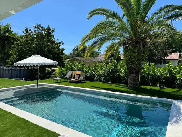 brand new pool with artifact turf surroundings