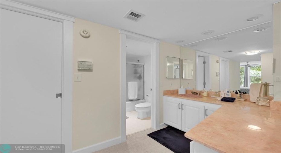 More closet space, large vanity, and tub/shower combo.