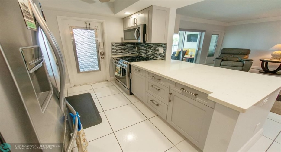 Open Kitchen to living room and convenient entry for bringing in groceries