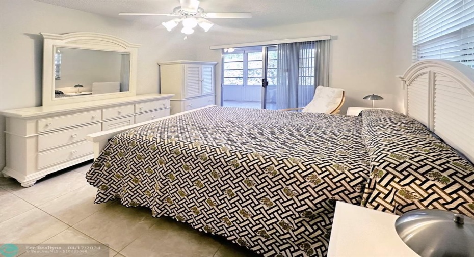 Primary Bedroom has Access to Enclosed Patio & Ensuite Bathroom