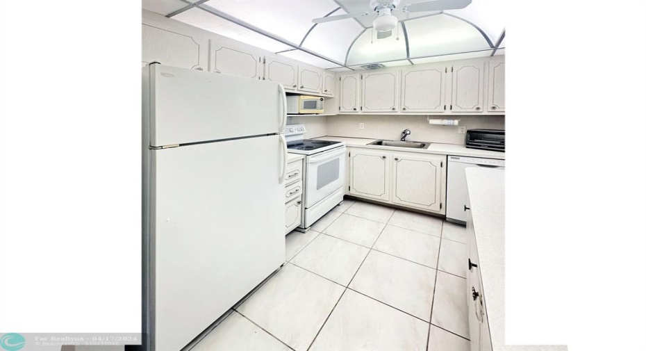 Tile Flooring Continues into Kitchen w/Domed Ceiling & Fan