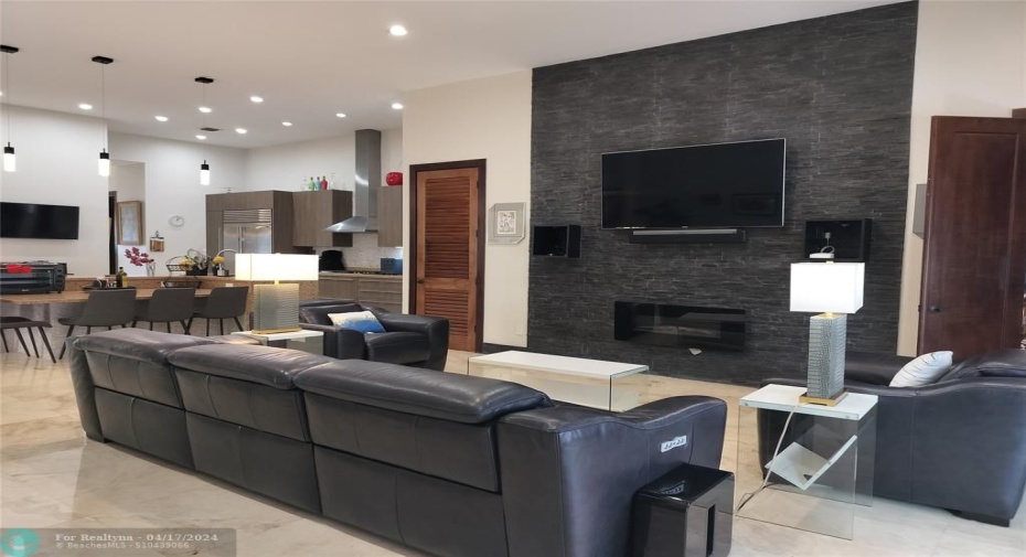 Custom Stone TV Wall with TV and electric fireplace (included) 12 '0 high ceilings