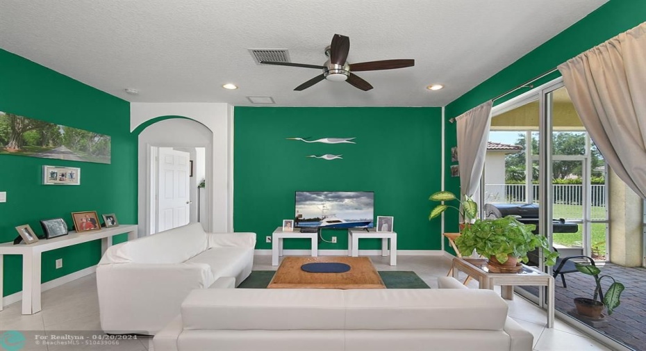 FAMILY ROOM WITH BIG SLIDING DOORS.