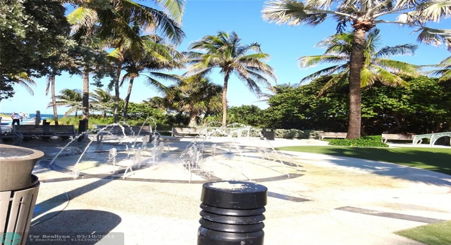 splash pad next to park on the beach