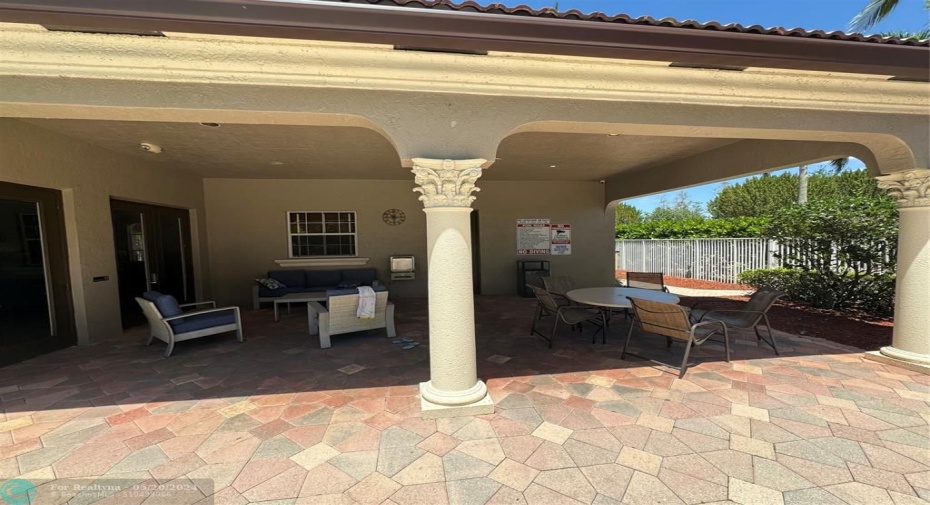 Covered area outside clubhouse on pool deck