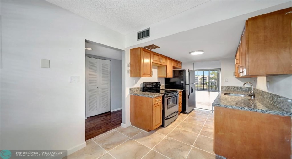 Kitchen With Entry to Hallway & Living Room