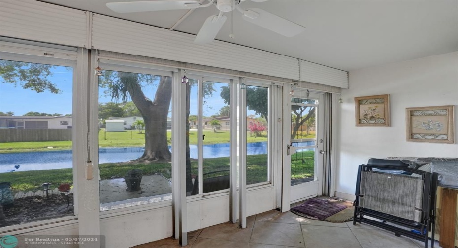 Florida Room with New Windows and Storm Shutters. Very Cozy Space on the Canal
