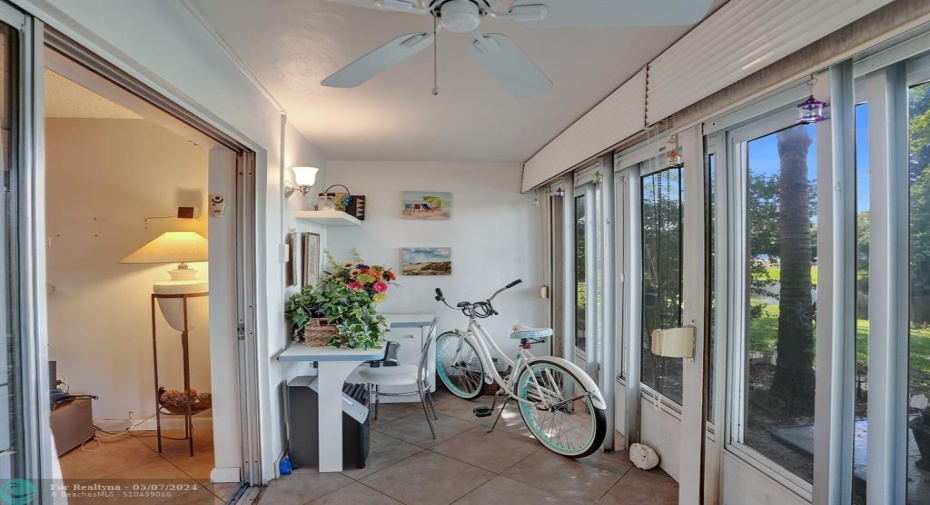 Florida Room with New Windows and Storm Shutters. Very Cozy Space to Enjoy on the Canal