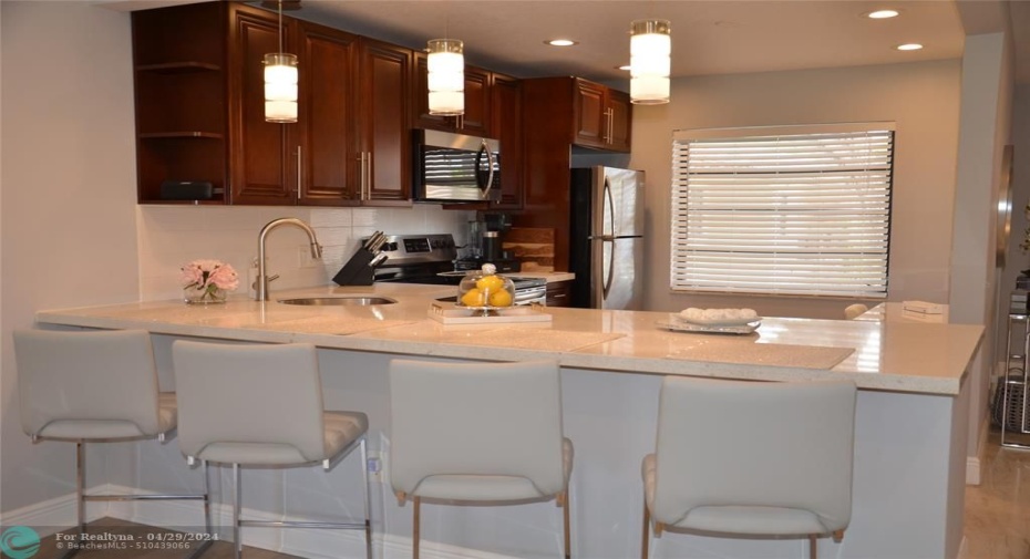 Remodeled open kitchen-quartz countertops