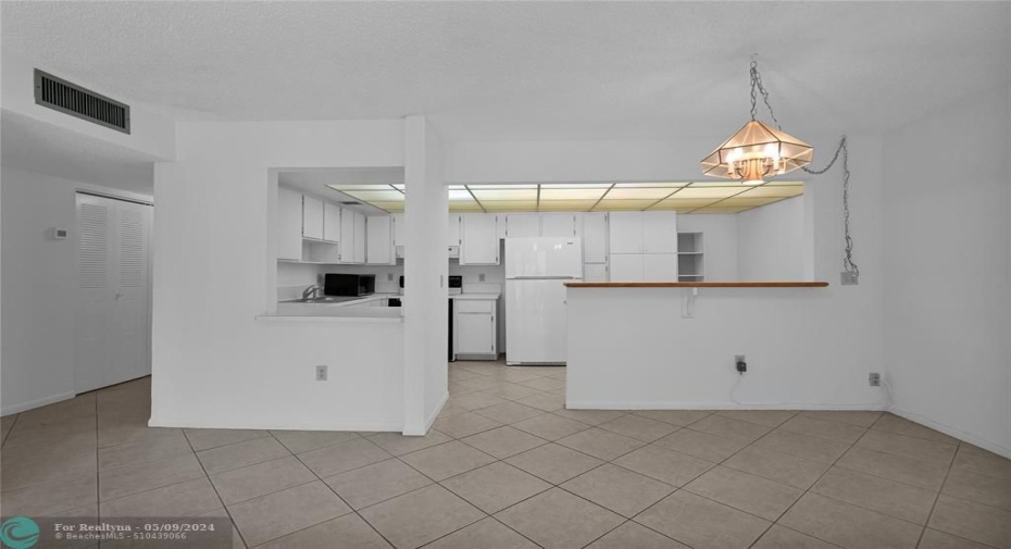 Looking from living room/dining area to open kitchen