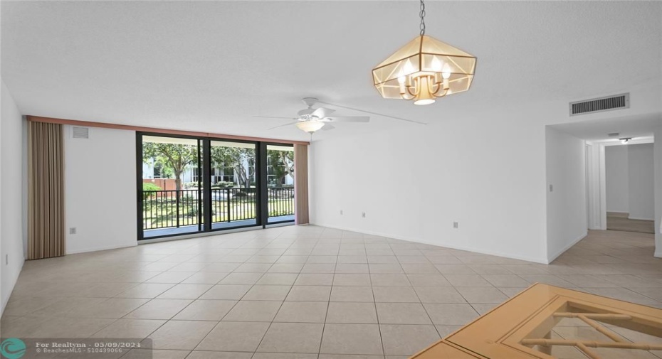 Living Room with new impact sliding glass to balcony