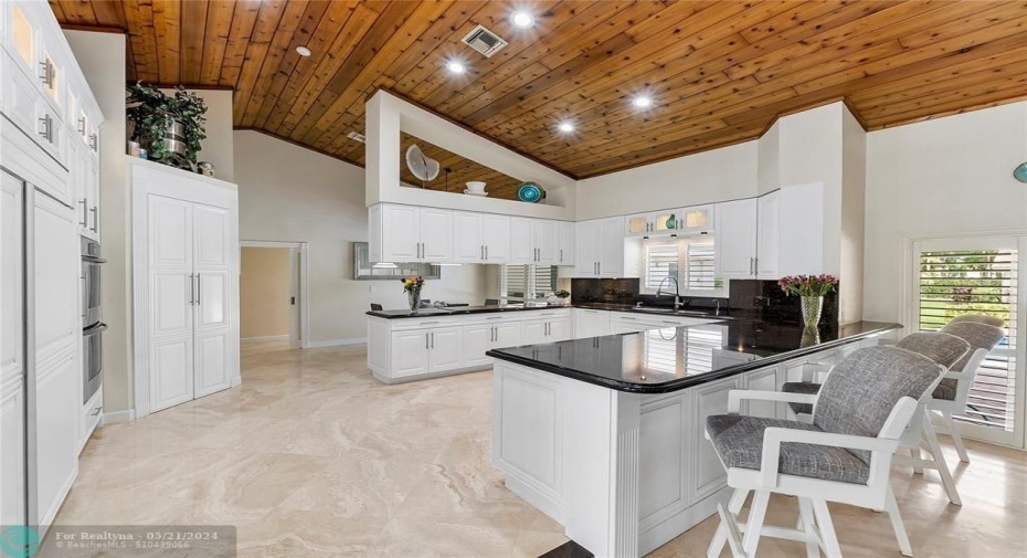 MAGNIFICENT EASY FLOW CUSTOM KITCHEN WITH ARCHITECTURAL CUT OUT DESIGNS-HIGH END APPLIANCES