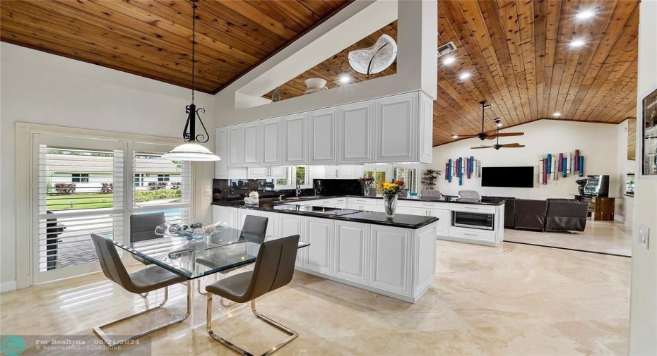 LARGE BREAKFAST AREA OPEN TO KITCHEN AND FAMILY ROOM-FRENCH DOORS TO PATIO