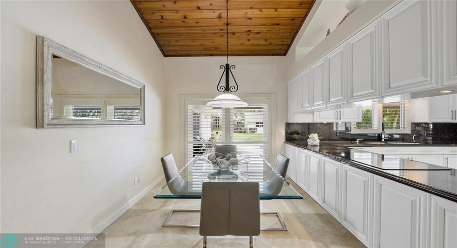 SEPARATE BREAKFAST AREA OVER LOOKING POOL AND PATIO-FRENCH DOORS