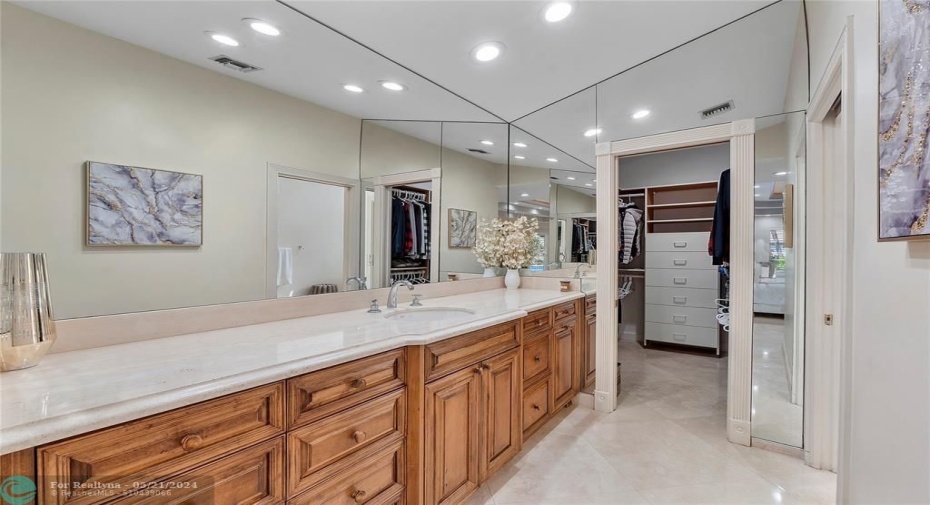 SEPARATE SINK AND COUNTER WITH OVER SIZED WALK IN CLOSET WITH BUILT INS-SEPARATE FROM OTHER SIDE WITH SINK AND COUNTER