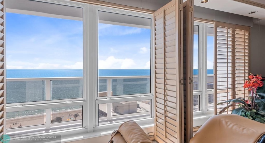 Direct east view from the master bedroom with impact windows and plantation shutters