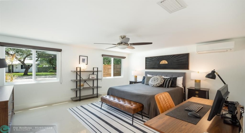 guest bedroom with plenty of room for a desk and chest of drawers.