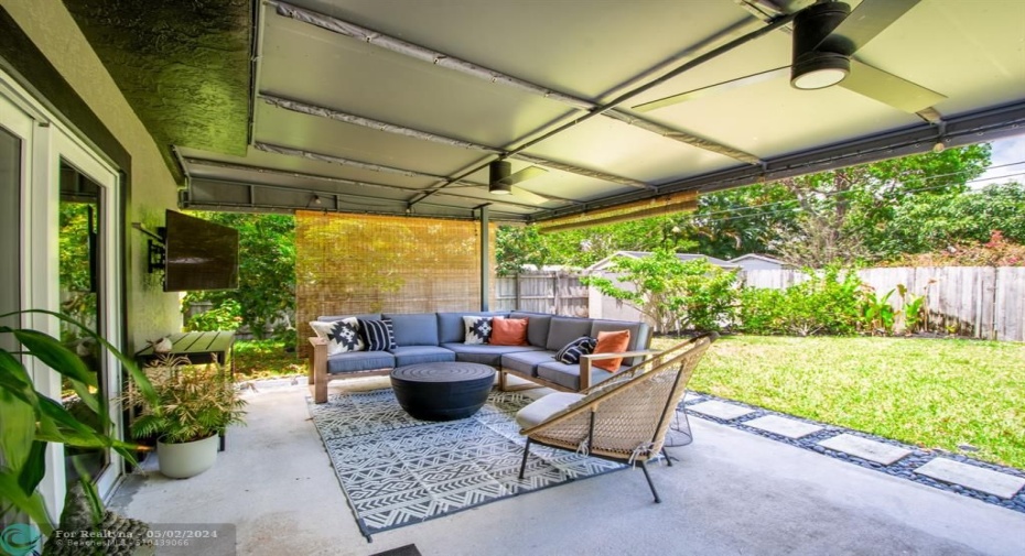 large covered patio areawith wall mounted TV