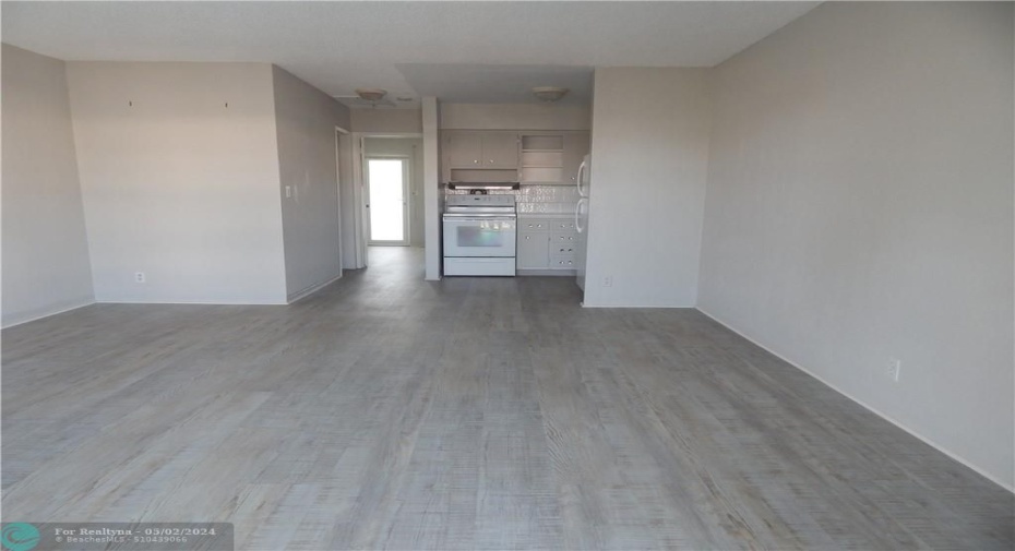 Open concept living room/ dining/kitchen