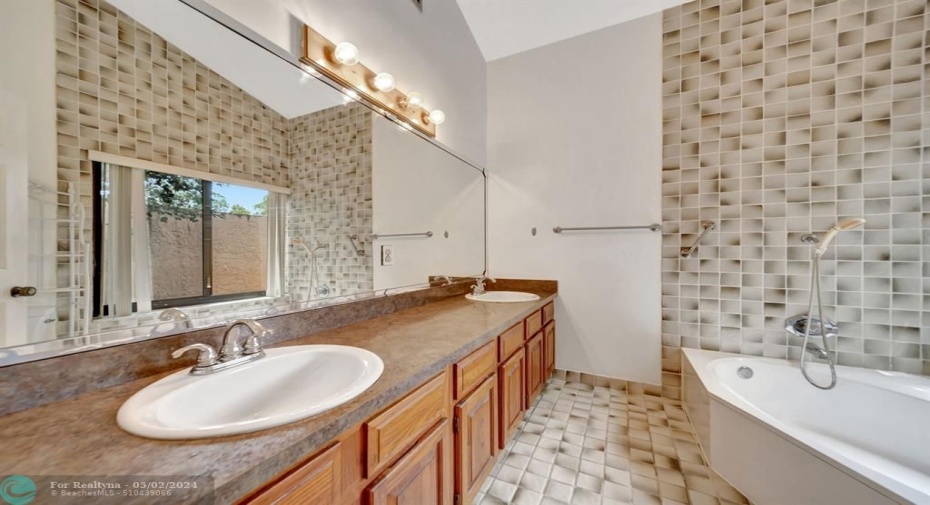 Main bath has vaulted ceilings also