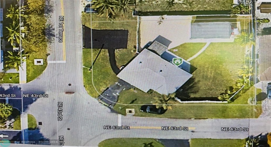 Areal view of corner lot and detached studio, plus graveled area to park RV or boat in the backyard.
