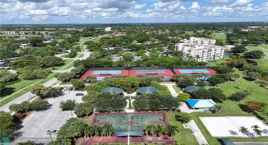 Aerial of George Brummer park right next door.  There is basketball, tennis, pickleball, bocce ball, handball, a playground, volleyball, and a library exchange.