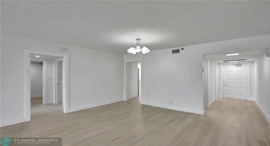 View of the foyer, kitchen, and main bedroom