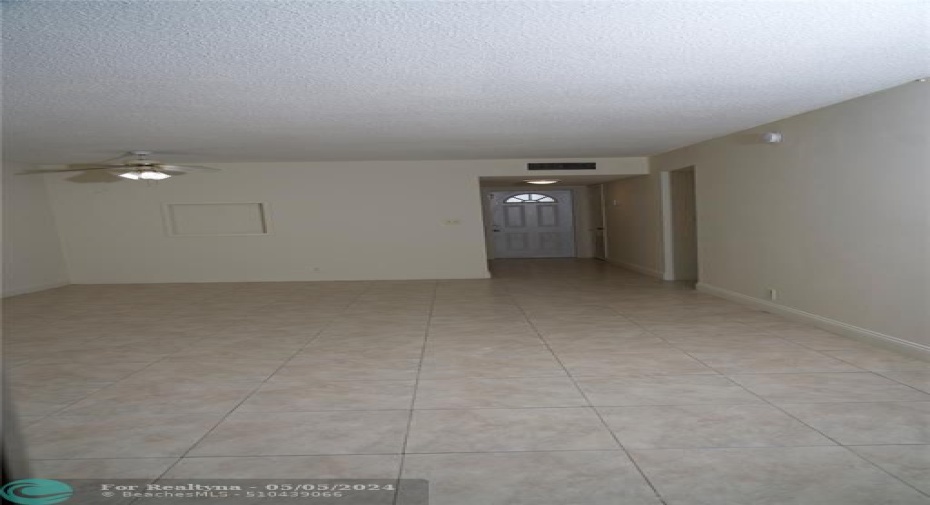 back of residence towards front door