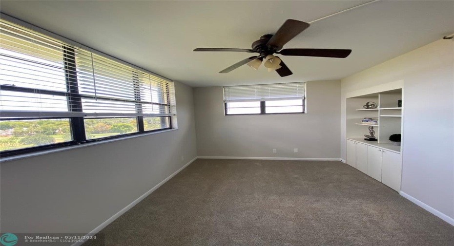 Third bedroom with fan and built in