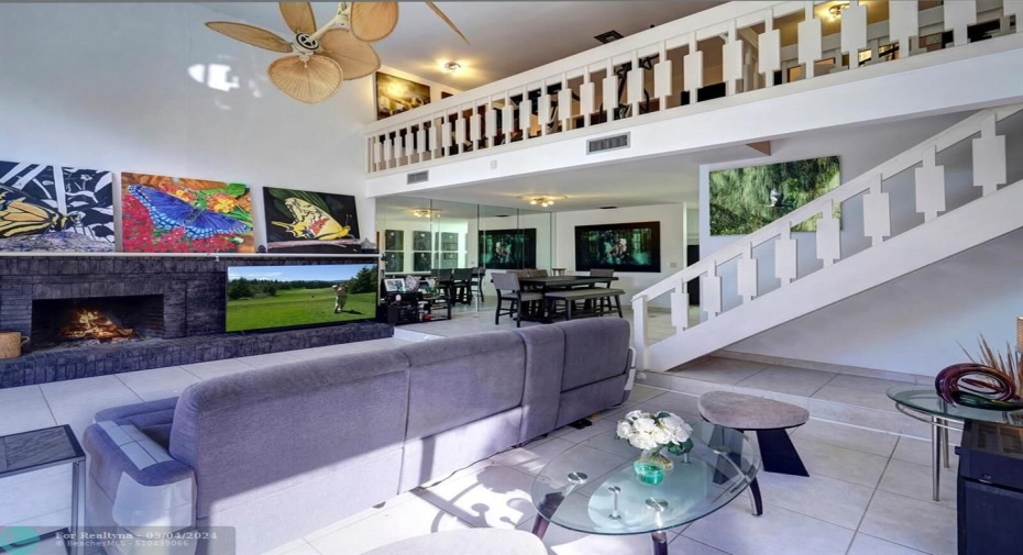 Volume ceilings and wood staircase