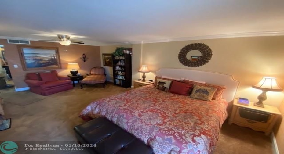 Bedroom with sitting area.