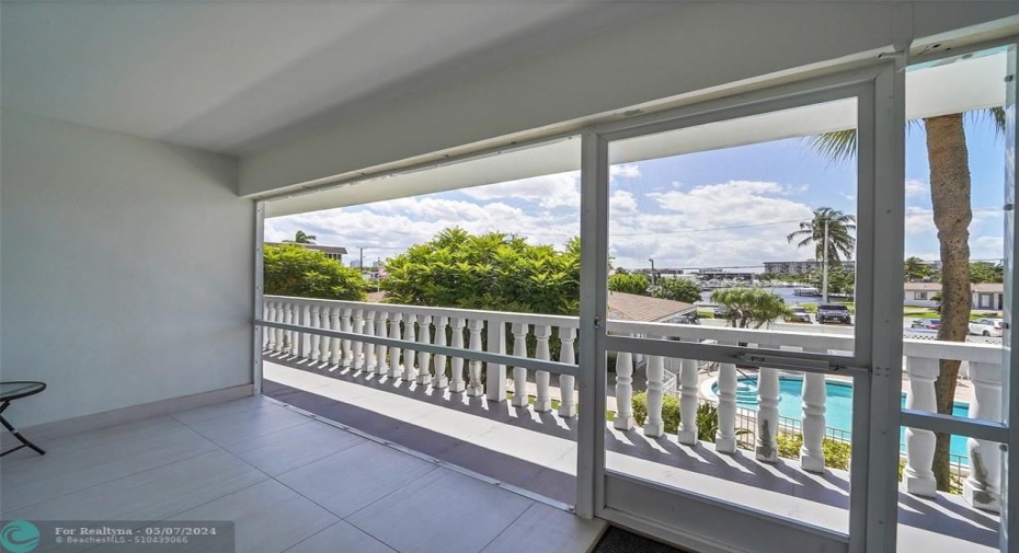 Screened in porch with water view