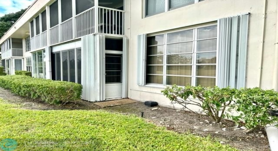 back of condo. according shutters.