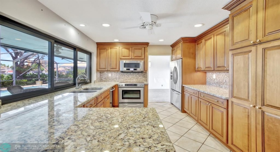 Kitchen with Pass-through Open to Pool and Family Room
