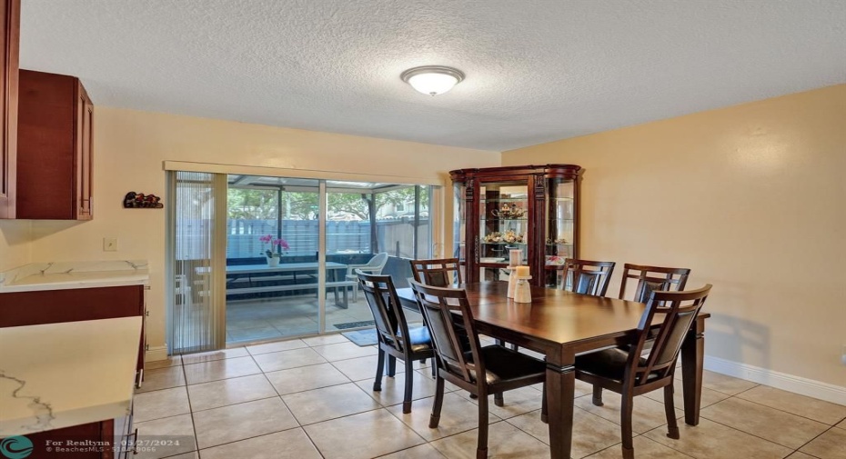 Dining room with sliding glass doors.