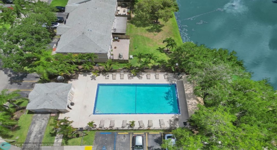 community pool, nearby park and basketball courts