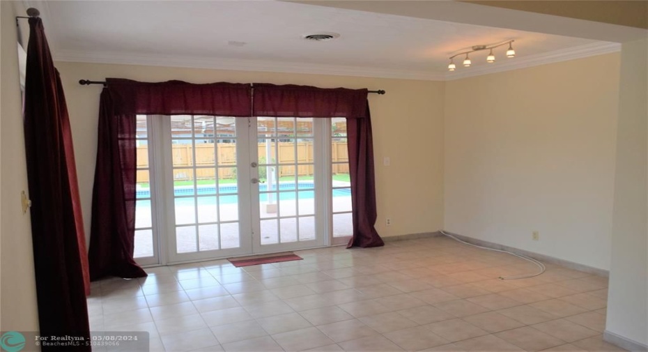 Family room with french doors to the pool