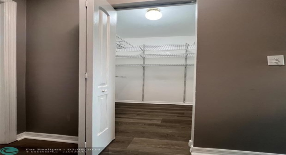 Walking closet in master bedroom