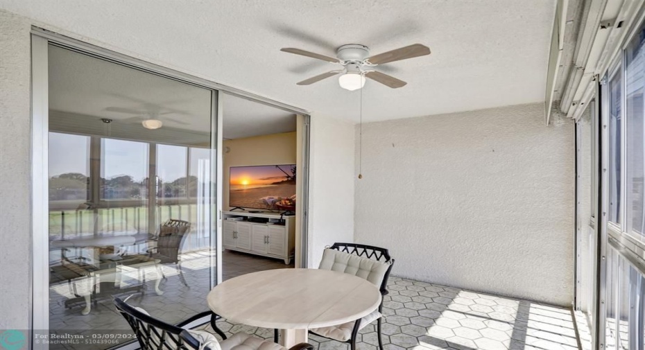 VERY LARGE FLORIDA ROOM WITH WINDOWS AND WROL-DOWN SHUTTERS.