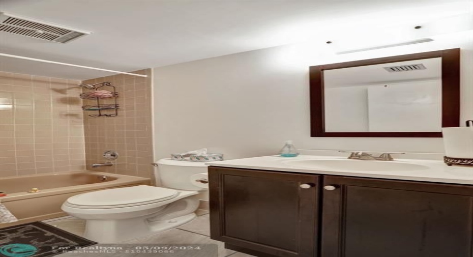 TOTALLY UPDATED GUEST BATH. 18X18 FLOOR TILE. NEW VANITY AND COMMODE