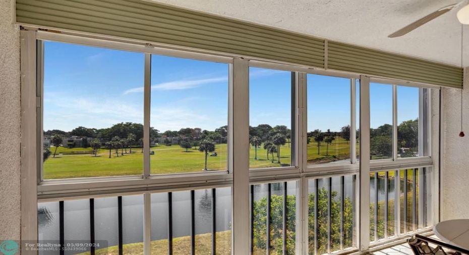 LARGE FLORIDA ROOM OVERLOOKING LAKE AND PUBLIC GOLF COURSE, TILED FLOORS, WROL-UP SHUTTERS AND WINDOWS.