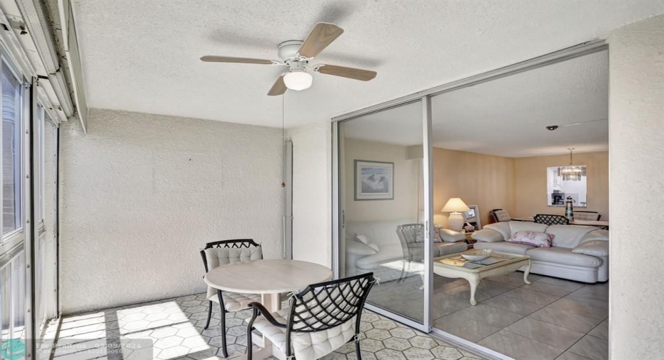 8 FOOT TALL SLIDING GLASS DOOR AT LIVING ROOM.