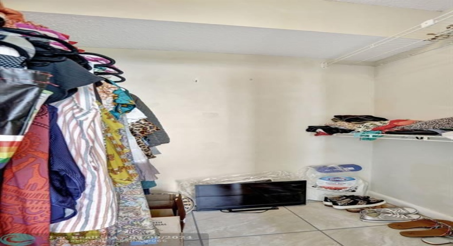 WALK IN CLOSET AT MASTER BEDROOM