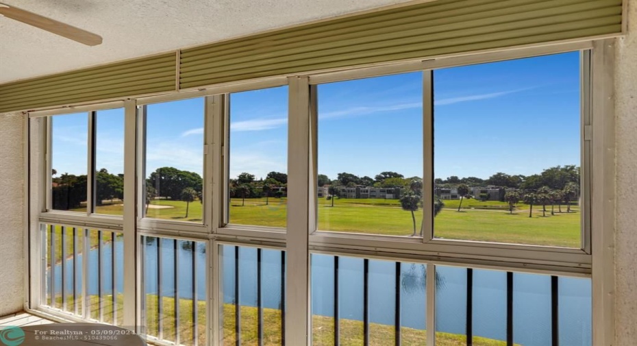 VERY LARGE FLORIDA ROOM WITH WROL-UP SHUTTERS. 18