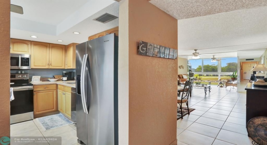 ENTRY FOYER TO KITCHEN LIVING ROOM AND GUEST HALL