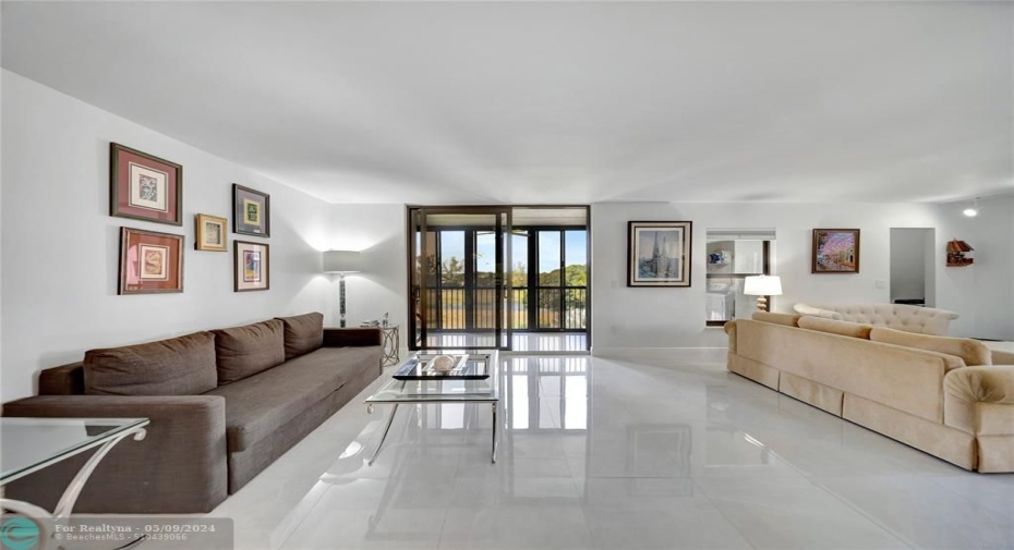 Spacious Living Room & Patio Doors To Screened Balcony